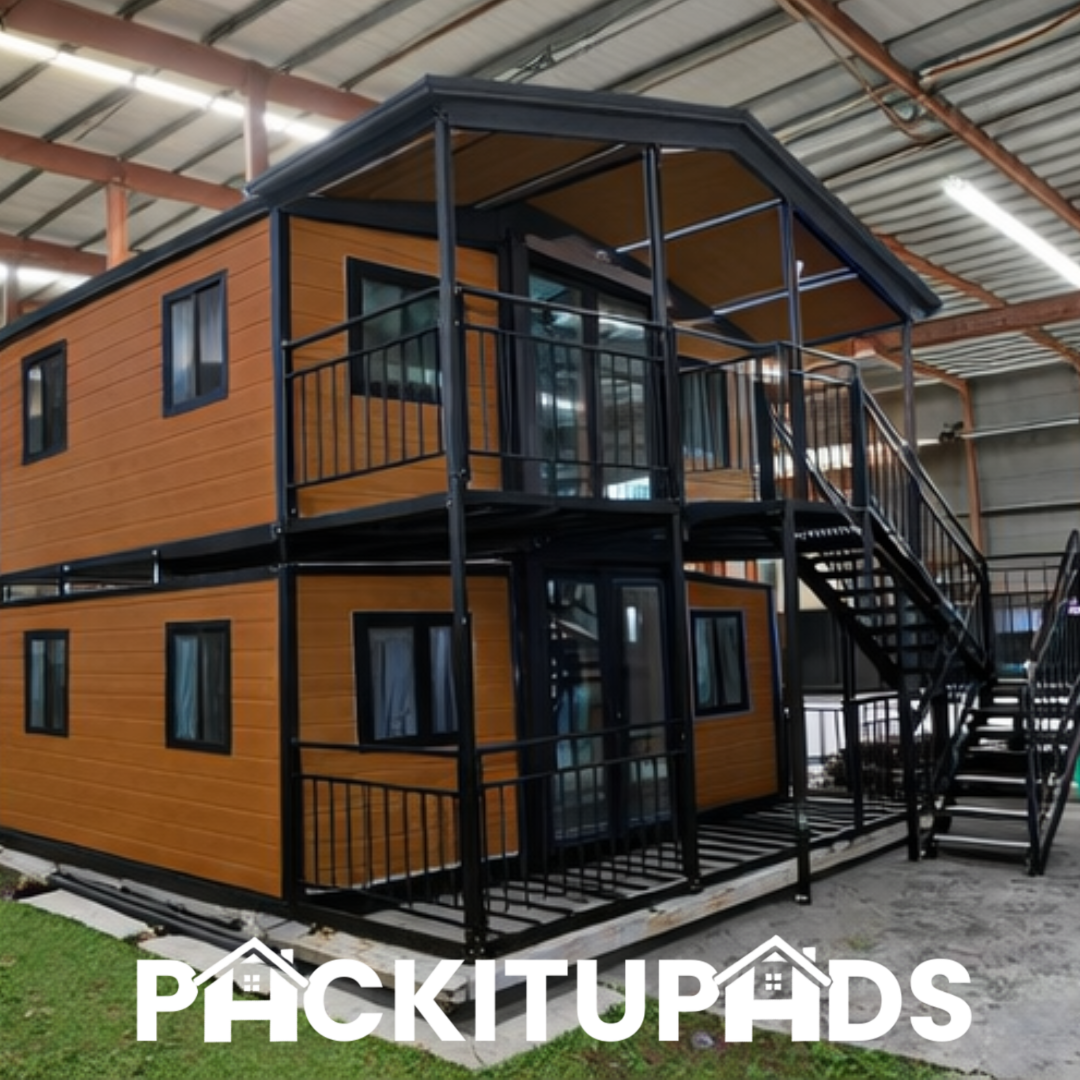 Two-story modular building with wooden exterior and metal staircase, branded 'Pickitupads'.